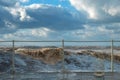 Muddy sea waves with spray and foam during storm at the sea