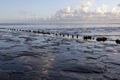 Muddy shore of dutch waddenzee at low tide on Vlieland Royalty Free Stock Photo
