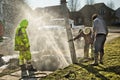 Muddy utility worker men fixing broken water line