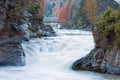 Muddy Waterfall on Autumn Mountain River