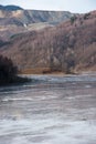 Muddy waters in a decantation pond. Toxic residuals from a copper mine decating in a settling basin