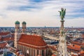 Aerial view of Munich: Muenchner Kindl on top of the New Town Hall and Frauenkirche