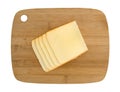 Muenster cheese slices on a wood cutting board