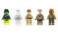 A group of five various Lego mini characters isolated on white.