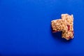 Muesli bar on a deep blue background Royalty Free Stock Photo