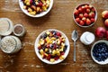 Muesli bar fresh organic fruits and cereal in a bowl on dark wooden table Royalty Free Stock Photo