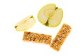 Muesli bars dried fruit on isolated background with apple Royalty Free Stock Photo