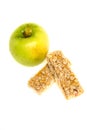 Muesli bars dried fruit on isolated background with apple Royalty Free Stock Photo