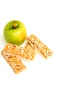 Muesli bars dried fruit on isolated background with apple Royalty Free Stock Photo