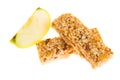 Muesli bars dried fruit on isolated background with apple Royalty Free Stock Photo