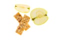Muesli bars dried fruit on isolated background with apple Royalty Free Stock Photo