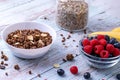 Muesli with berries and chia seeds on a wooden table