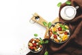 Muesli bowl, organic ingredients for healthy breakfast Granola, nuts, dried fruits, oatmeal, whole grain flakes on white