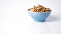 Muesli in bowl on white background Royalty Free Stock Photo