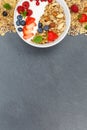 Muesli breakfast fruits yogurt strawberries cereals bowl slate p Royalty Free Stock Photo