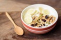 Muesli cereal with slice banana and milk in a bowl Royalty Free Stock Photo