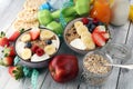 Muesli with dairy and fruit, healthy lifestyle. bowl of cereal, fruit and dumbbell.