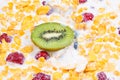 Muesli and fresh berries and fruits kiwi Royalty Free Stock Photo