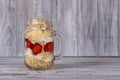 Muesli made from red strawberries, banana, chia seeds, oat flakes, honey and dressed with yogurt Royalty Free Stock Photo