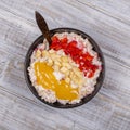 Muesli made from red strawberries, banana, chia seeds, oat flakes, honey and dressed with yogurt Royalty Free Stock Photo