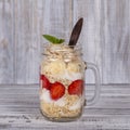 Muesli made from red strawberries, banana, chia seeds, oat flakes, honey and dressed with yogurt Royalty Free Stock Photo