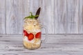 Muesli made from red strawberries, banana, chia seeds, oat flakes, honey and dressed with yogurt Royalty Free Stock Photo