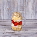 Muesli made from red strawberries, banana, chia seeds, oat flakes, honey and dressed with yogurt Royalty Free Stock Photo