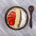 Muesli made from red strawberries, banana, chia seeds, oat flakes, honey and dressed with yogurt Royalty Free Stock Photo