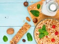 Muesli, milk and nuts on blue background Royalty Free Stock Photo