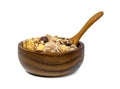 Muesli multi fruit in wooden bowl and spoon isolated on white background Royalty Free Stock Photo