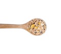 Muesli multi fruits in spoon isolated on white background. top view