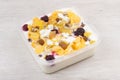 Muesli with pineapple, raisins, raspberry, dried apricots and yo