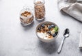 Muesli with vegetarian yogurt, banana and blueberries in a bowl on a gray background. Healthy and dietary homemade granola for Royalty Free Stock Photo