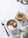 Muesli with vegetarian yogurt, banana and blueberries in a bowl on a light background. Healthy and dietary homemade granola for Royalty Free Stock Photo