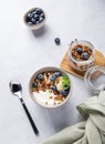 Muesli with vegetarian yogurt, banana and blueberries in a bowl on a light background. Healthy and dietary homemade granola for Royalty Free Stock Photo