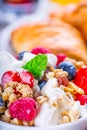 Muesli with yogurt and berries on a wooden table. Healthy fruit and cereal brakfast Royalty Free Stock Photo