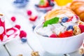 Muesli with yogurt and berries on a wooden table. Healthy fruit and cereal brakfast Royalty Free Stock Photo