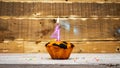 Happy birthday copy space. Muffin candle burning background for anniversary 4