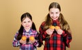 Muffin fight. Small children happy smiling with quickbread muffins. Happy little girls baking breakfast muffins at home Royalty Free Stock Photo