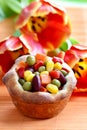 Muffin filled with vegetables on orange table cloth