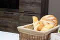 Muffin lies in the kitchen in a small basket, loaves, bread and rolls. Bad food, fullness, copy space