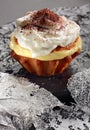 Muffin with pudding filling and whipped cream