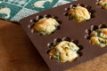 Muffin with salmon, spinach and cheese in silicone bakeware