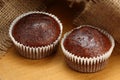 Muffins on brown jute background , cup cakes