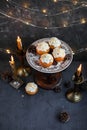 Muffins with butter cream in a vintage plate. New Year`s festive desserts