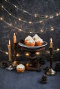 Muffins with butter cream in a vintage plate. New Year`s festive desserts