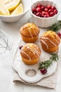 Muffins, cakes with cranberry and lemon on a white board. Royalty Free Stock Photo