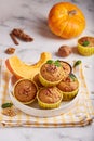 Muffins with pumpkin, walnuts and cinnamon. Delicious homemade dessert. Royalty Free Stock Photo