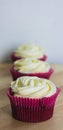 Muffins in a row. Three red velvet muffins Royalty Free Stock Photo