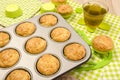 Muffins in a tray and on colorful napkin. Royalty Free Stock Photo